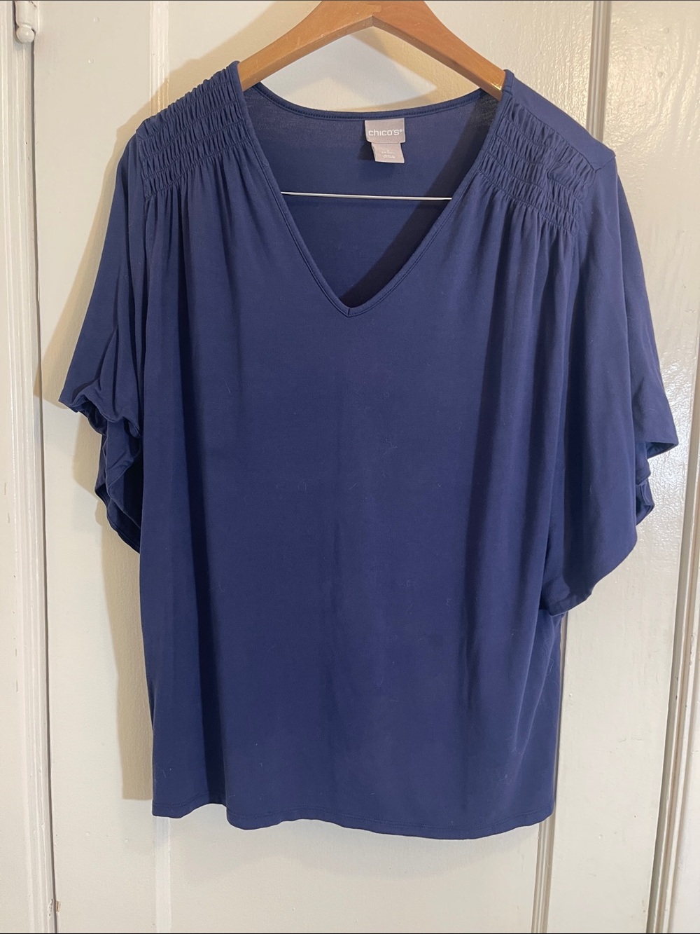 77. Chico's Navy V-Neck Smocked Shoulder Flutter Sleeve To